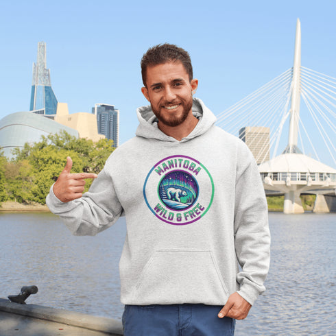 Embrace the power and beauty of the north with our Manitoba – Wild & Free hoodie, featuring a bold graphic of a polar bear beneath the awe-inspiring northern lights.